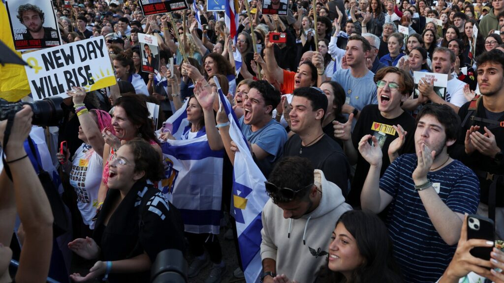 Israelis cheer as Hamas hands first captives over to the Red Cross | Israel-Palestine conflict