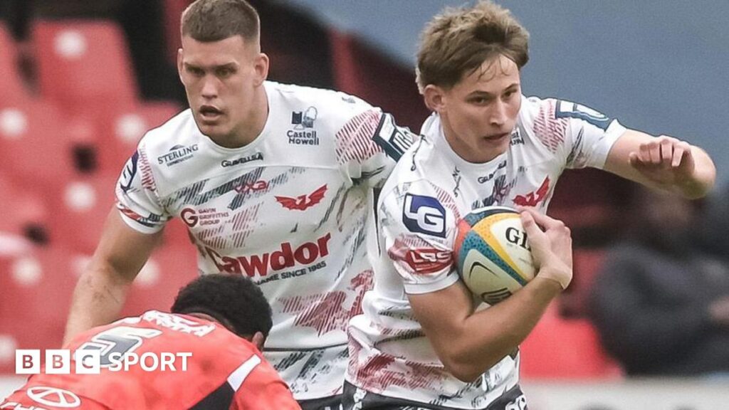 Sam Surridge celebrates
