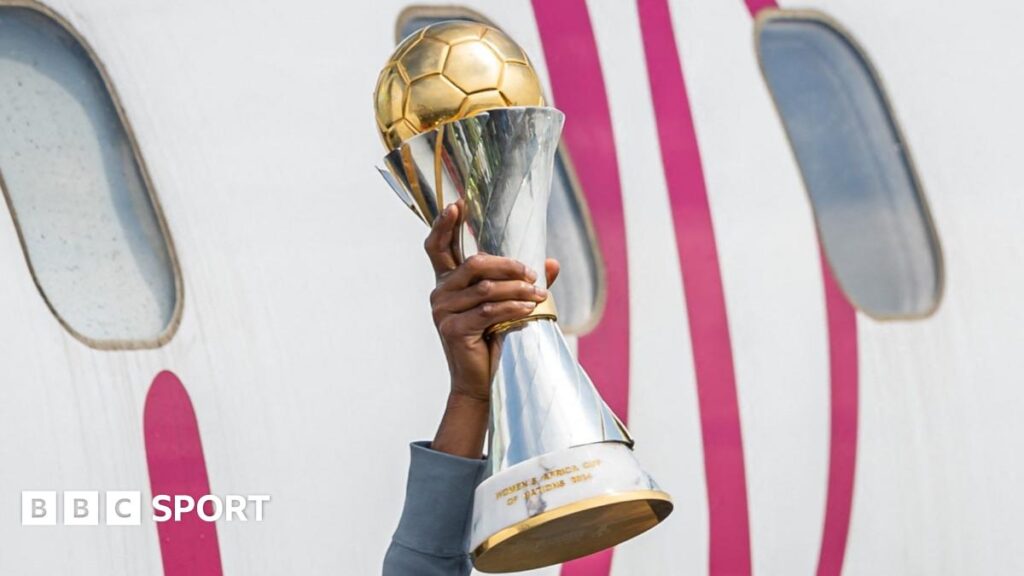 Wafcon 2026: Holders Nigeria and debutants Cape Verde and Malawi qualify Tabitha Chawinga in all dark blue kit and pink boots is pictured mid-stride running with a football which has a star motif on it during a match between Lyon and Arsenal in the Uefa Women's Champions League. Chawinga has her head up and is looking at an opponent who is seen from behind in red and white kit coming to challenge her